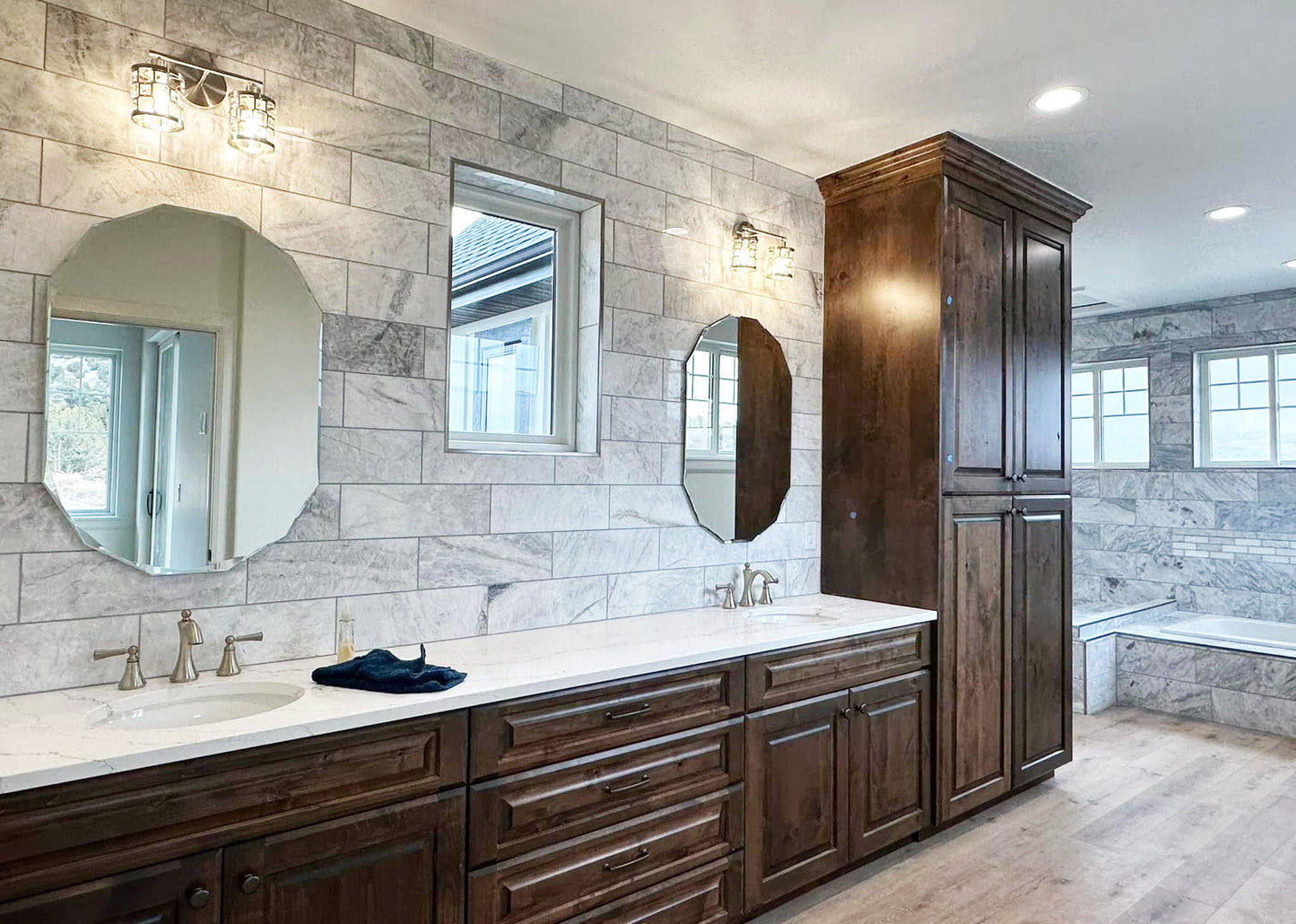 a bathroom with two sinks and a large mirror