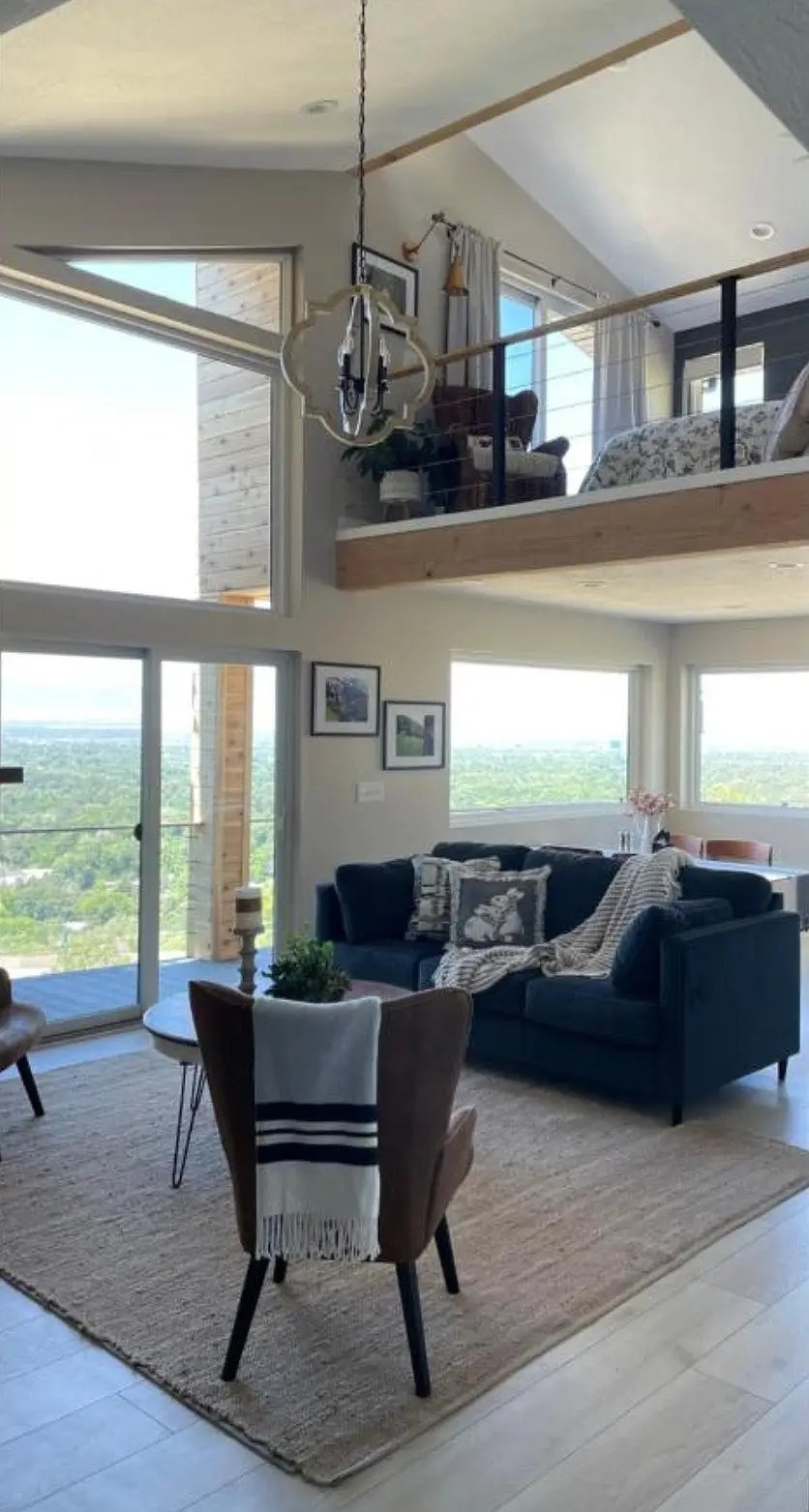 photo of vaulted living room with loft