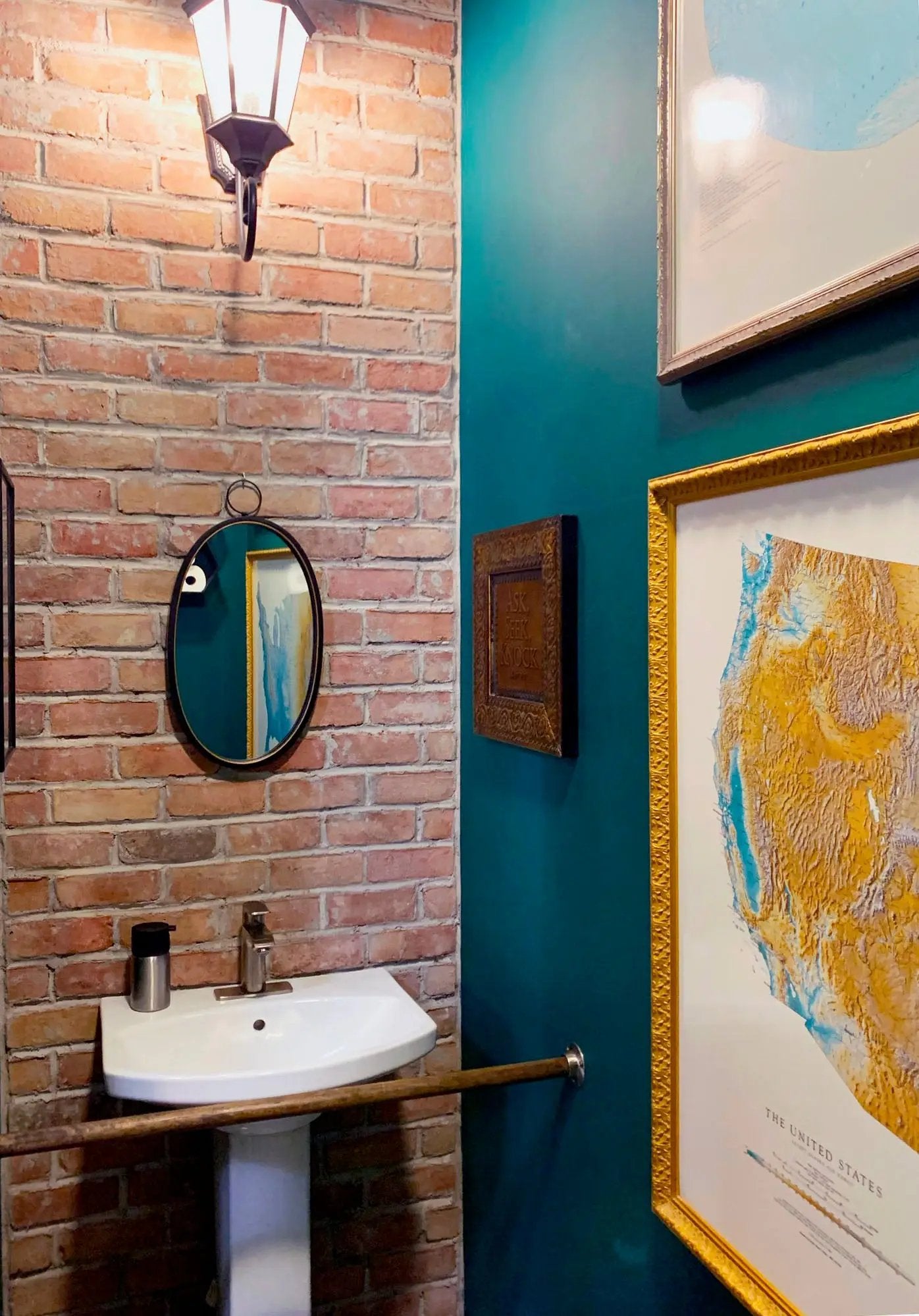 bathroom with brick wall