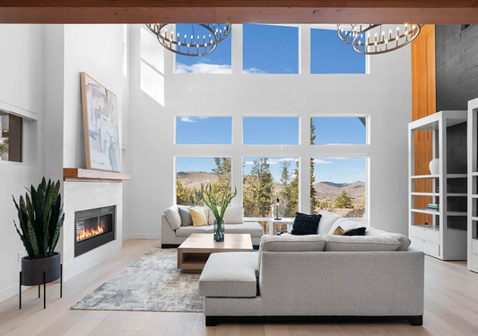 See-through fireplace from living room to outdoor patio in this Park city home designed and built by Authentic Homes