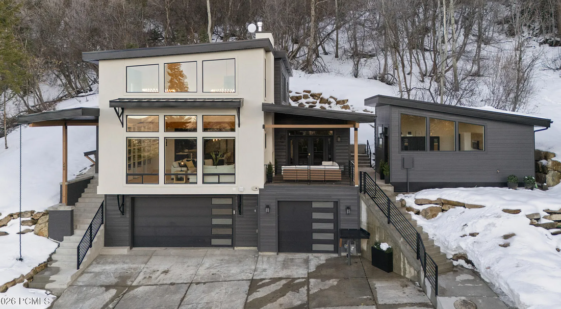 Heated roof and downspout chains on a home design designed and built by Authentic Homes in Parke city Utah
