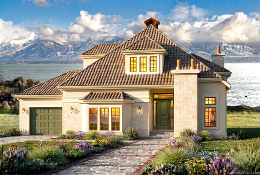Front view of a two-story European house with a dark shingled roof, stone and white siding, a garage, and a stone walkway leading to the front door, with mountains and water in the background.