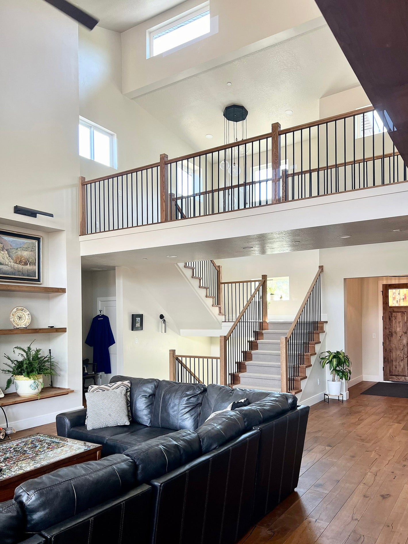 Modern home in Springville, Utah. House plan by Authentic Homes Custom Home Builder design/build in Utah. Catwalk and dramatic stairwell..
