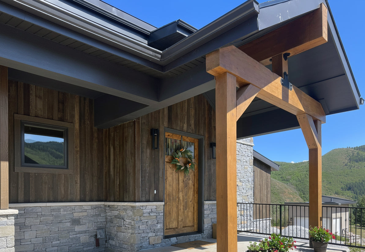 Modern No.11 house plan by Authentic Homes builder in Utah featuring rustic wood and stone exterior with dramatic entry and covered porch.