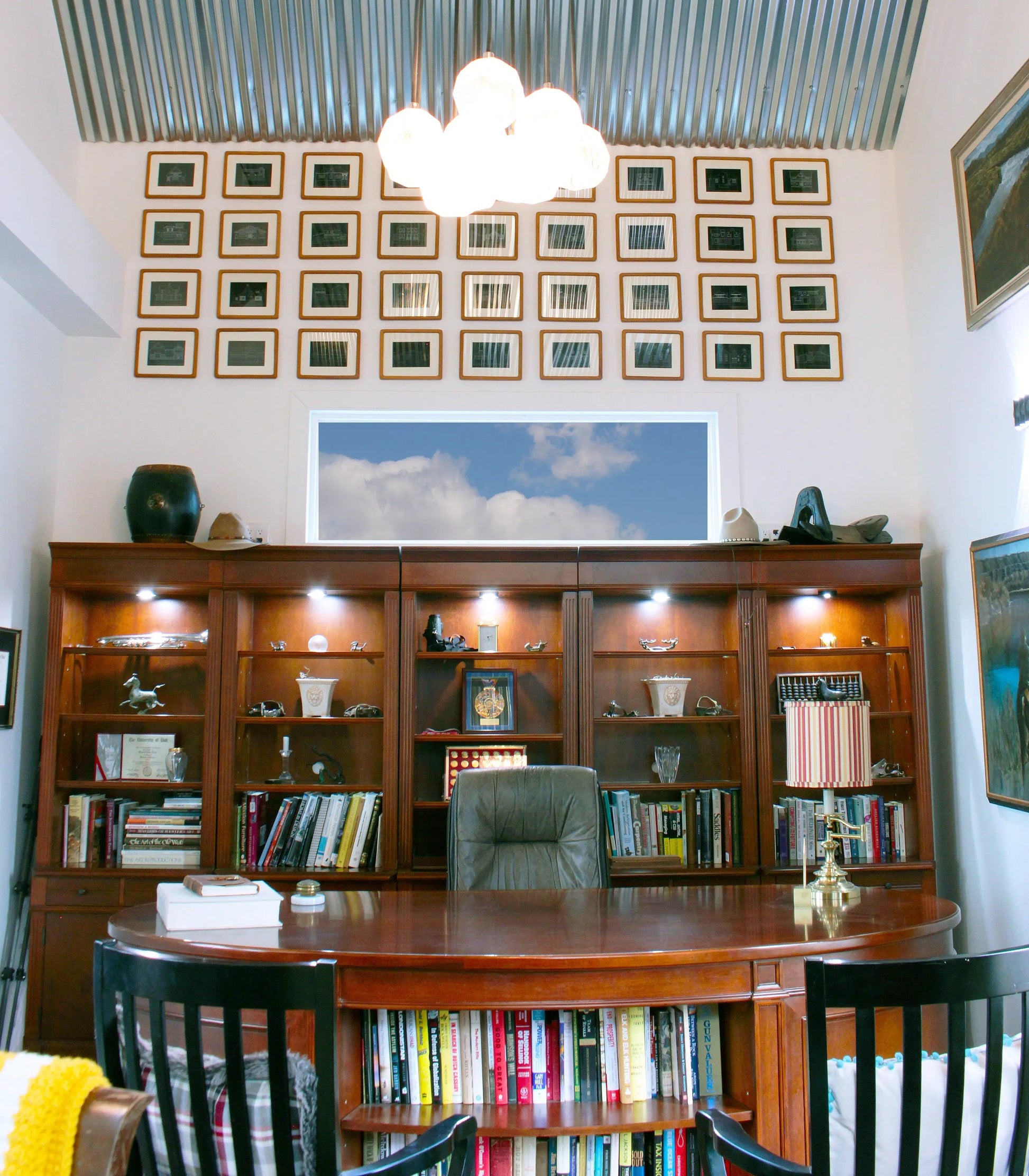 office with metal ceiling and library