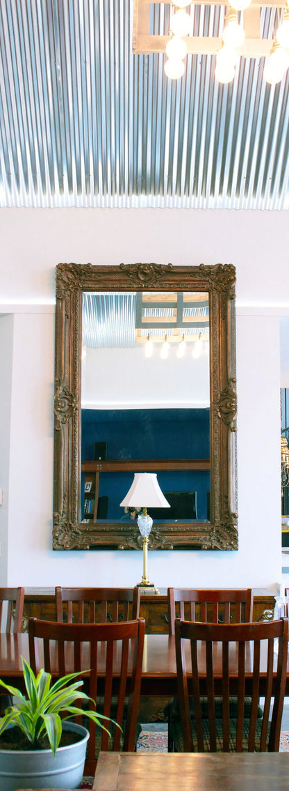 tin ceiling large mirror and buffet